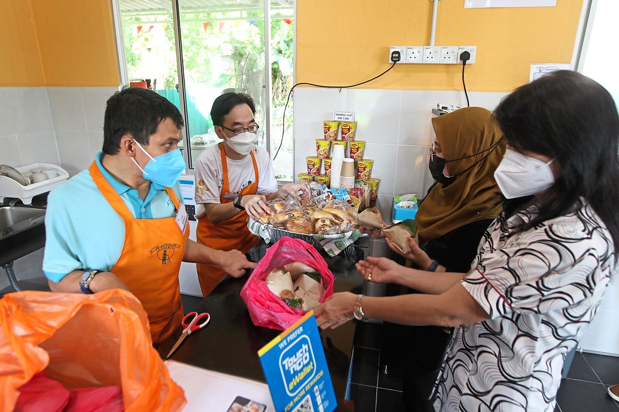 The newly opened Sunshine Cafeteria in the compound of the centre is manned by adult students with cerebral palsy. — Photos: KAMARUL ARIFFIN/The Star